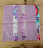 Cushion cover made in a purple polka dot theme with envelope closure. - Image 1