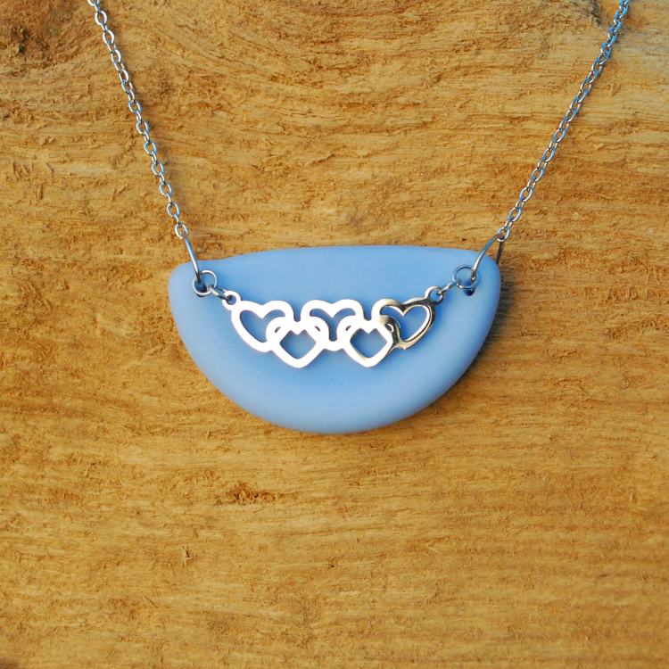 Blue beach glass pendant with multiple hearts
