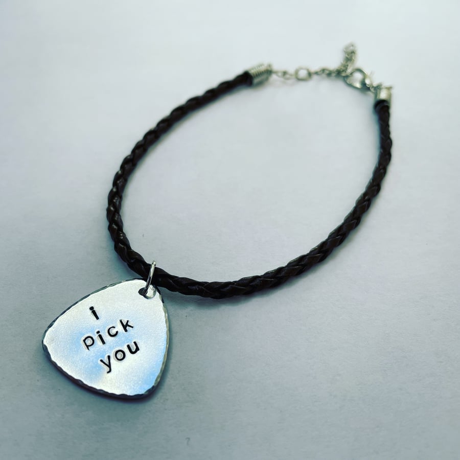 Leather bracelet with guitar pick charm