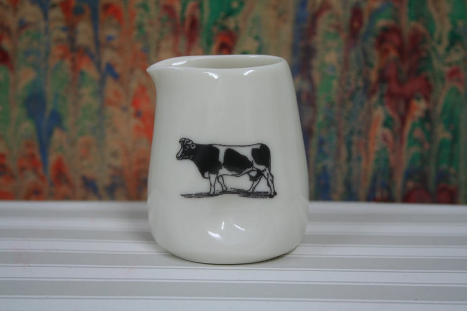 Small porcelain jug with pinched sides