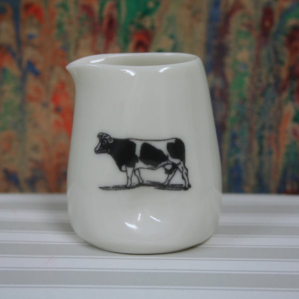 Small porcelain jug with pinched sides