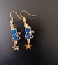 Celestial dark blue and gold cat and star dangle earrings (sun pattern)