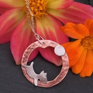 Dog and ball pendant