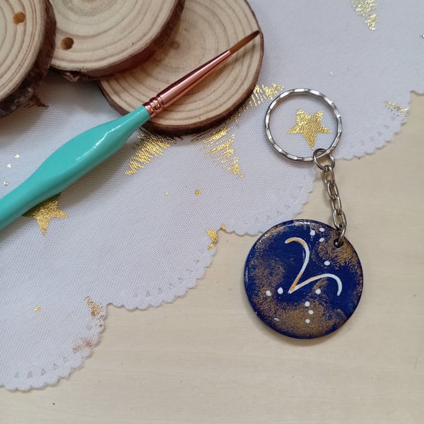 Wooden circular starsign aries keyring