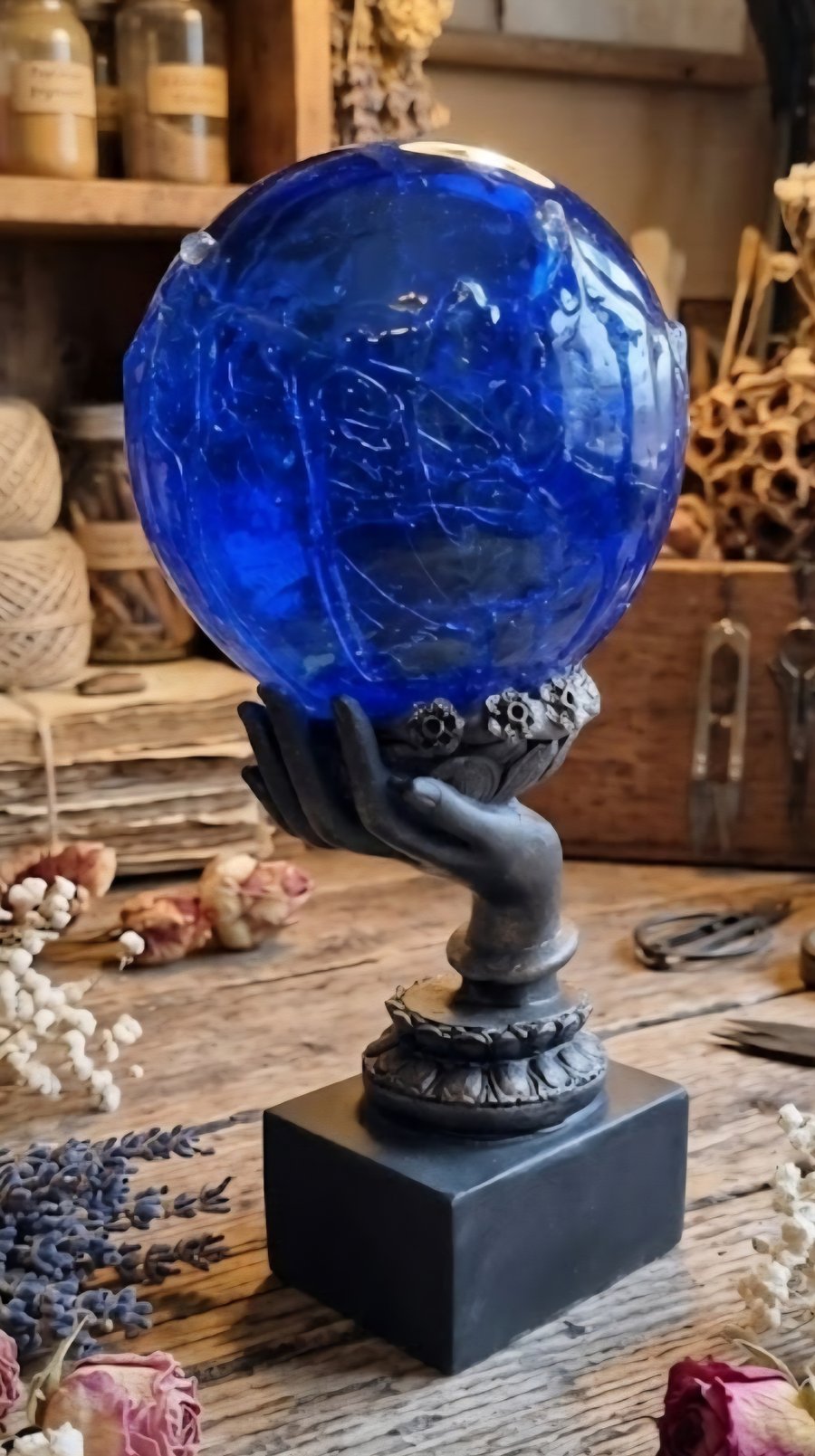 Rippled Blue Seer Ball on Hand Stand. Mystical Resin Sphere