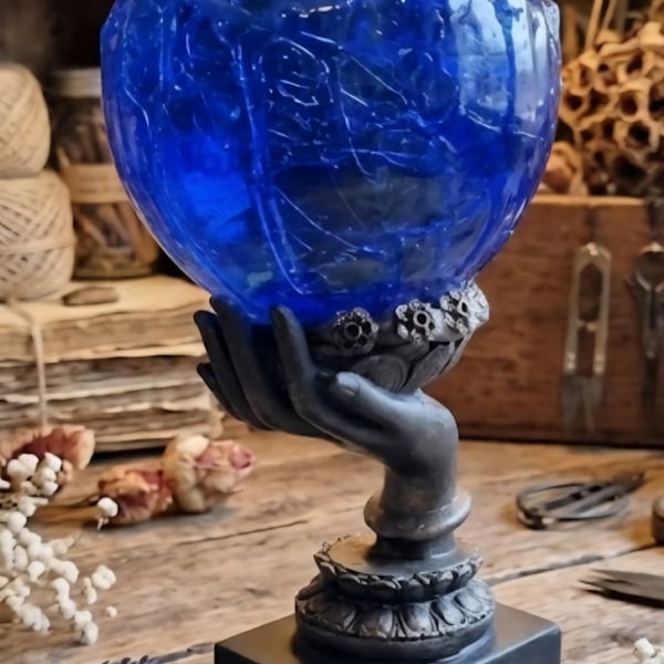 Rippled Blue Seer Ball on Hand Stand. Mystical Resin Sphere