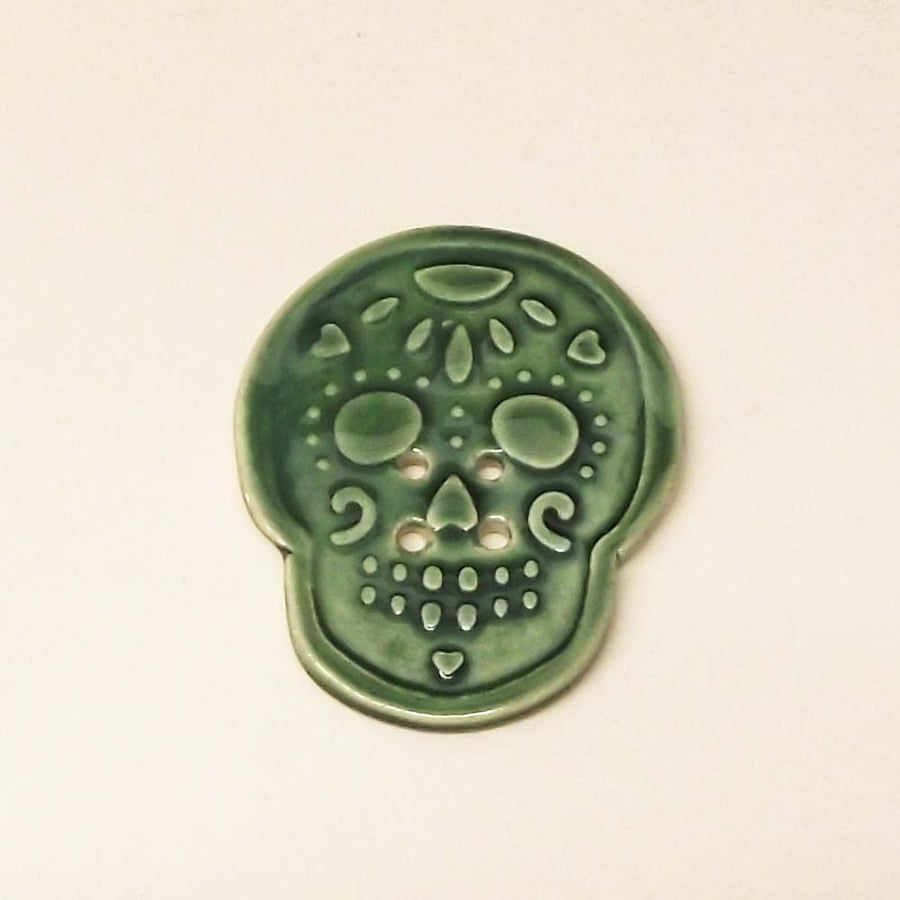 Ceramic skull button green Pottery