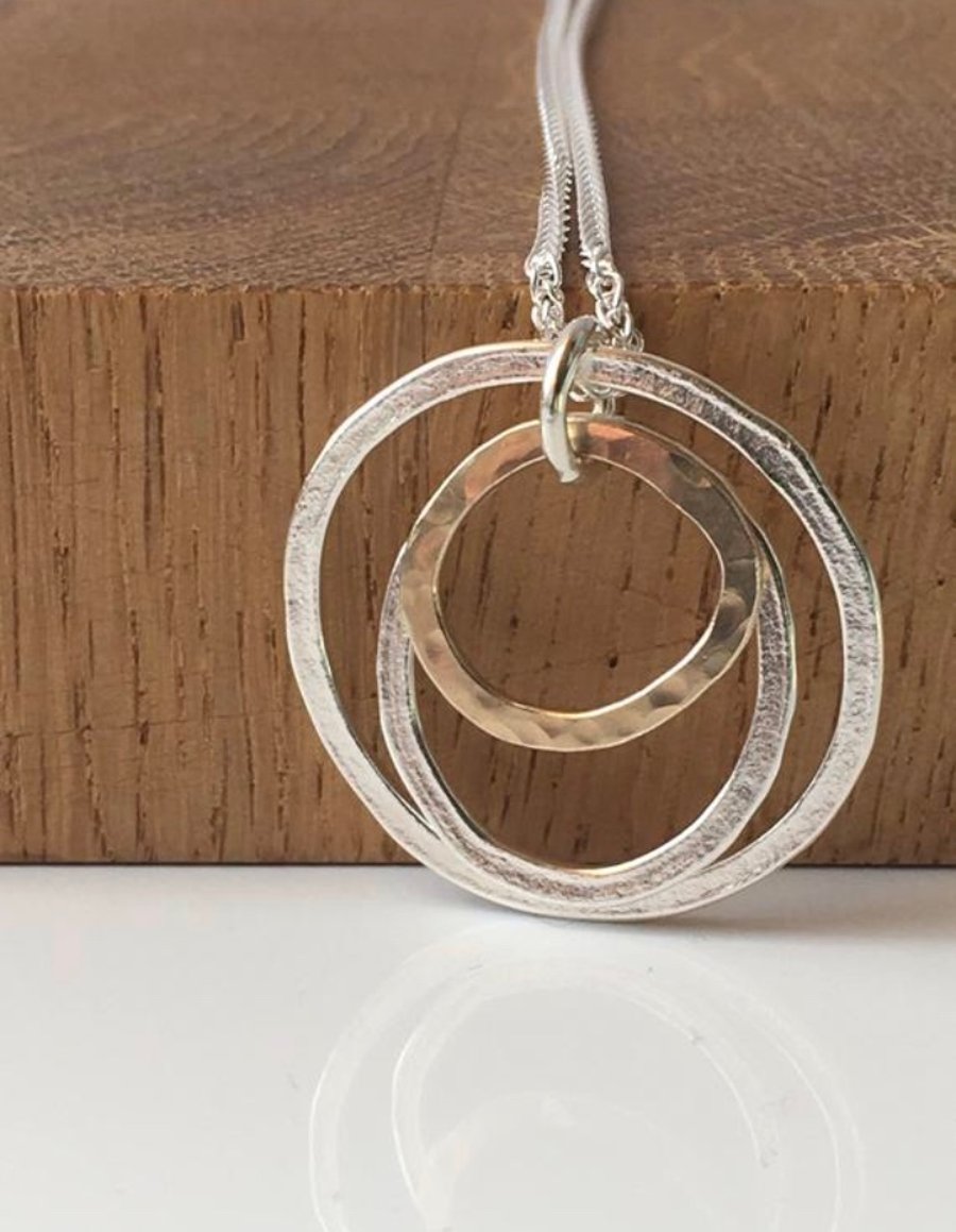 Silver and gold circle pendant 