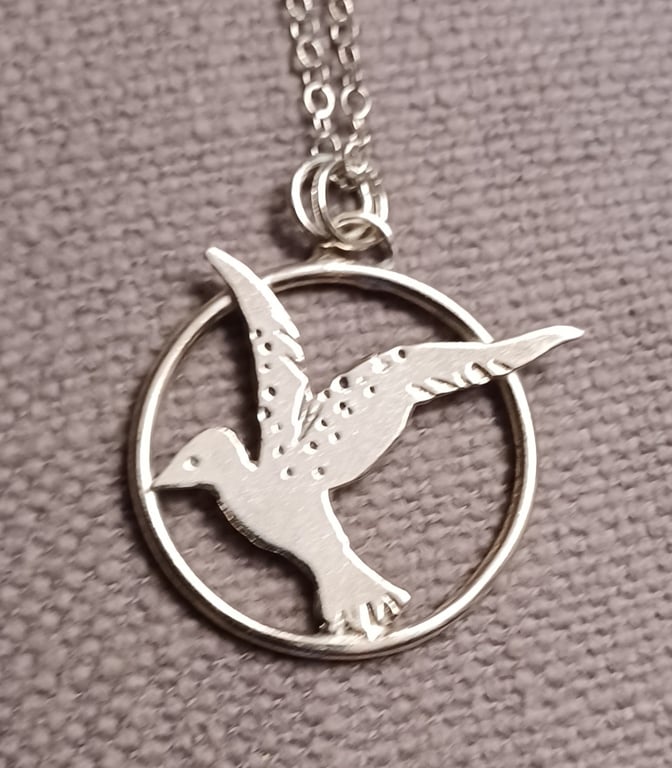 Flying bird pendant