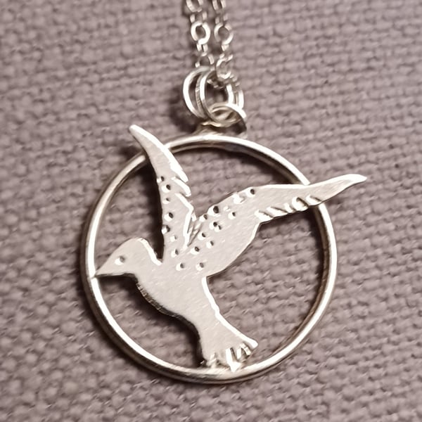 Flying bird pendant