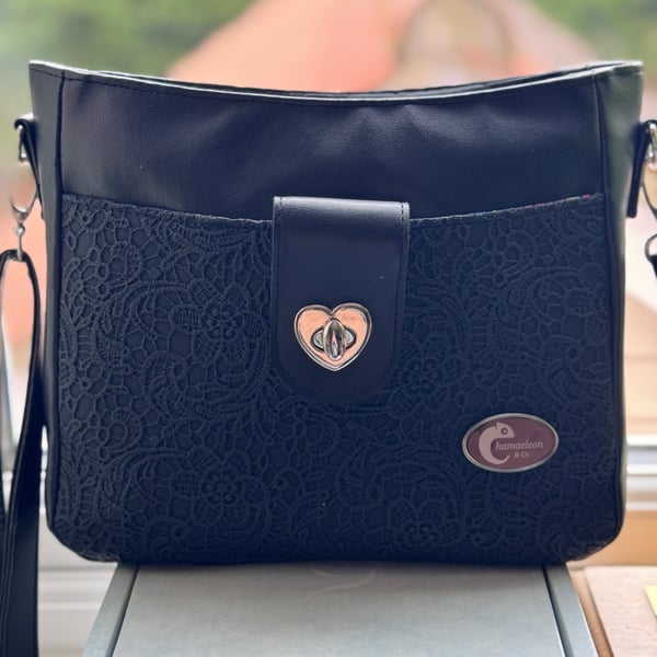 Lace effect black faux leather crossbody bag with loads of pockets