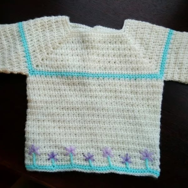 Crochet Baby jumper in cream with mauve embroidered flowers 22 in chest. 
