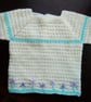 Crochet Baby jumper in cream with mauve embroidered flowers 22 in chest.  - Image 1