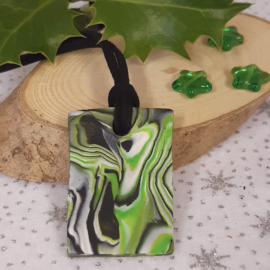 Bright green and black rectangular polymer clay pendant