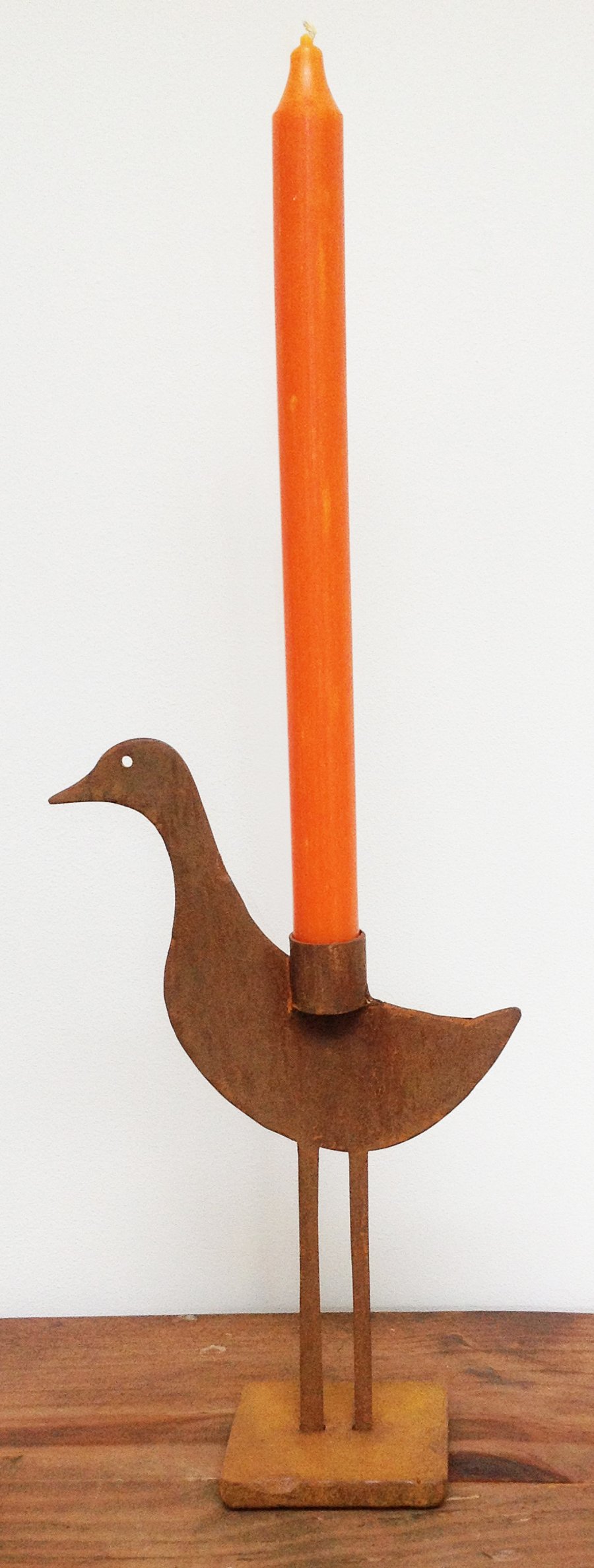 rusted sculptured metal duck candle holder