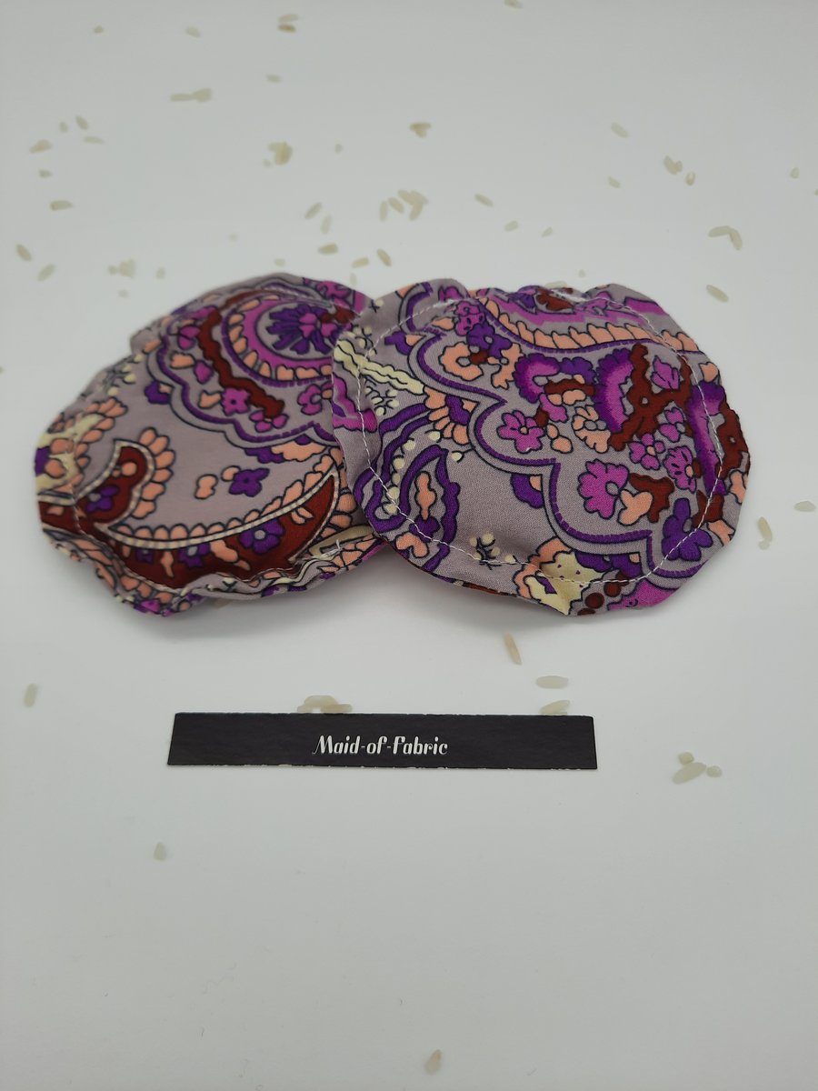 Hand warmers rice filled in purple patterned fabric. 