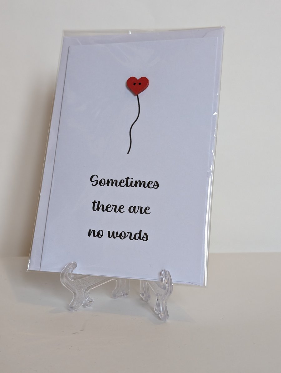 Sympathy card "Sometimes there are no words" with a red heart button 