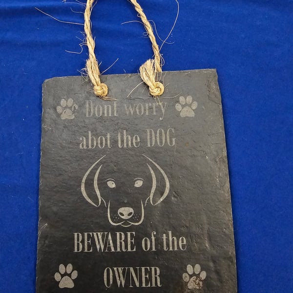 Don't worry about dog beware of the owner slate sign
