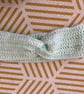 Comfy turquoise crochet headband with twist detail