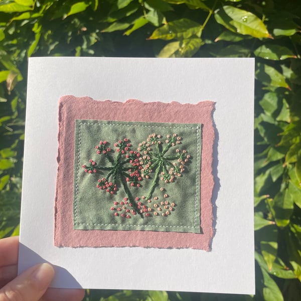 Pink flowers on green fabric, hand embroidered keepsake card