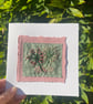Pink flowers on green fabric, hand embroidered keepsake card