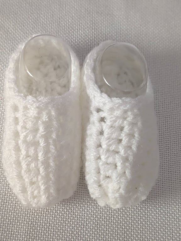 White baby shoes newborn