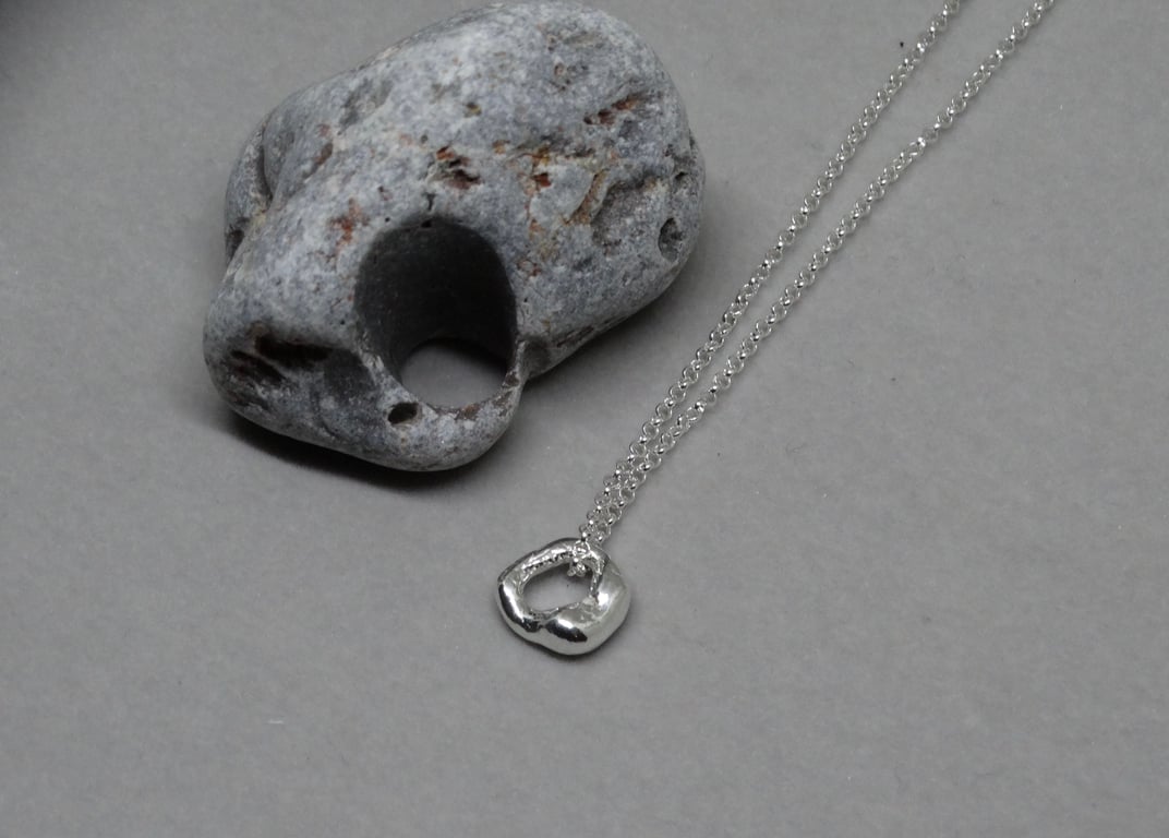 Silver hagstone pendant - molten silver - nugget 