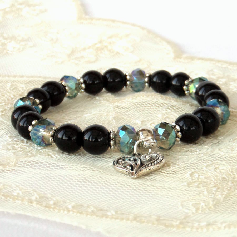 Stretchy black onyx and green crystal bracelet, with heart charm 