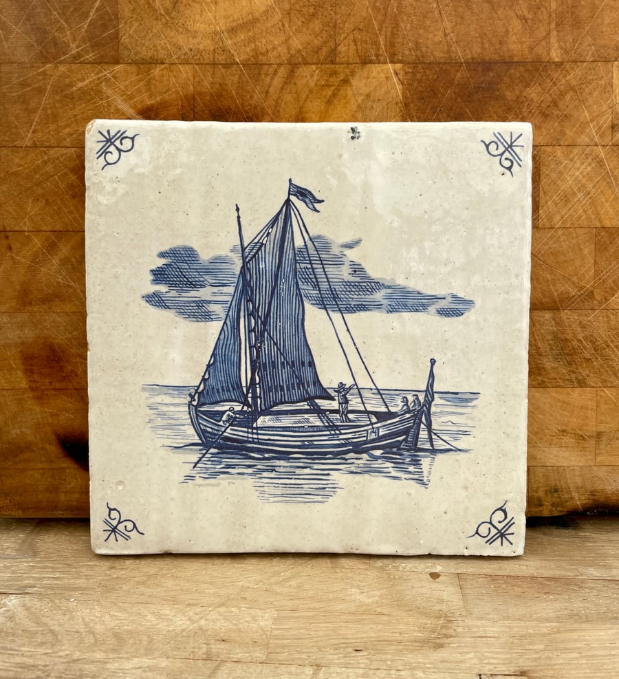 Handmade stoneware tile with ship at sea image