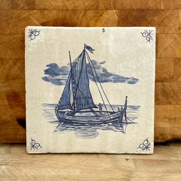 Handmade stoneware tile with ship at sea image