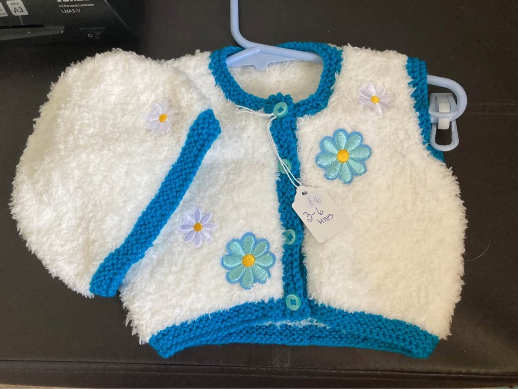 Faux fur waistcoat and hat in white and teal with flower decals