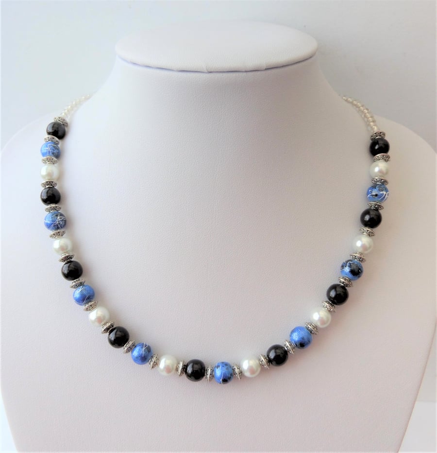 Blue, black and white glass bead necklace