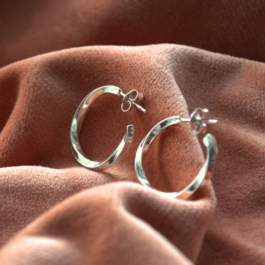 Sterling silver twisted hoop earrings.