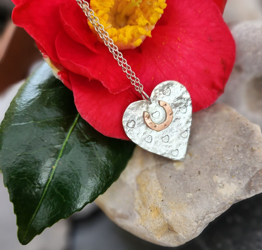 Heart in sterling silver with copper horseshoe pendant