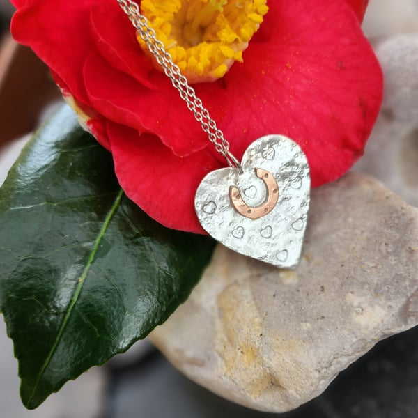Heart in sterling silver with copper horseshoe pendant