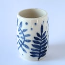 A pretty little porcelain posy vase made by Linda in her pottery in Winchester