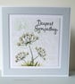 Sympathy card with summer flowers subtly shaded a pale peach