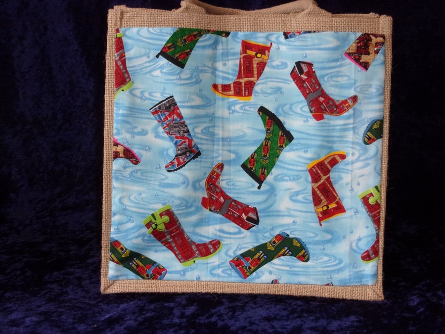 Medium Jute Bag with Boots on a Blue background