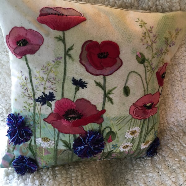 Poppy and field flower cushion