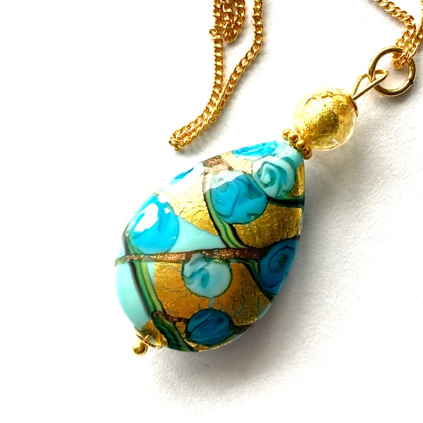 Murano glass blue and gold pear drop pendant with Swarovski and gold chain.