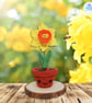 Crochet daffodil in smiley flower pot. Crochet daffodil. Crochet flower pot.
