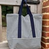 Large striped market tote with bright pink lining
