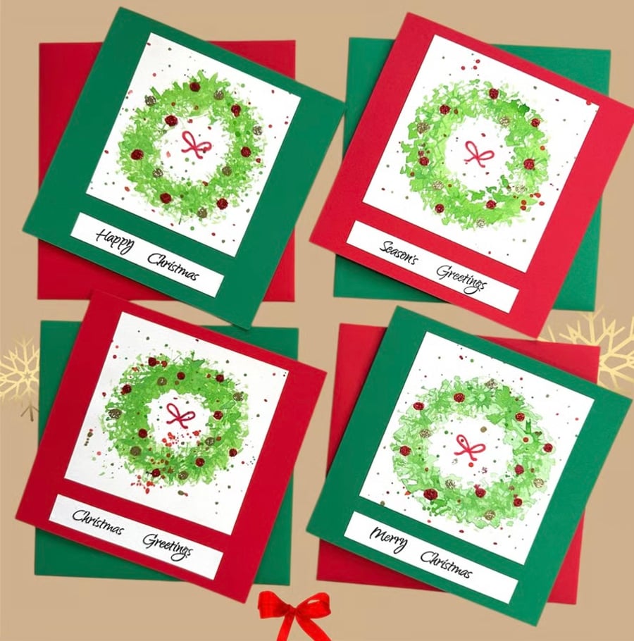 Packs of 3 watercolour Christmas cards of Holly wreaths with glittery baubles