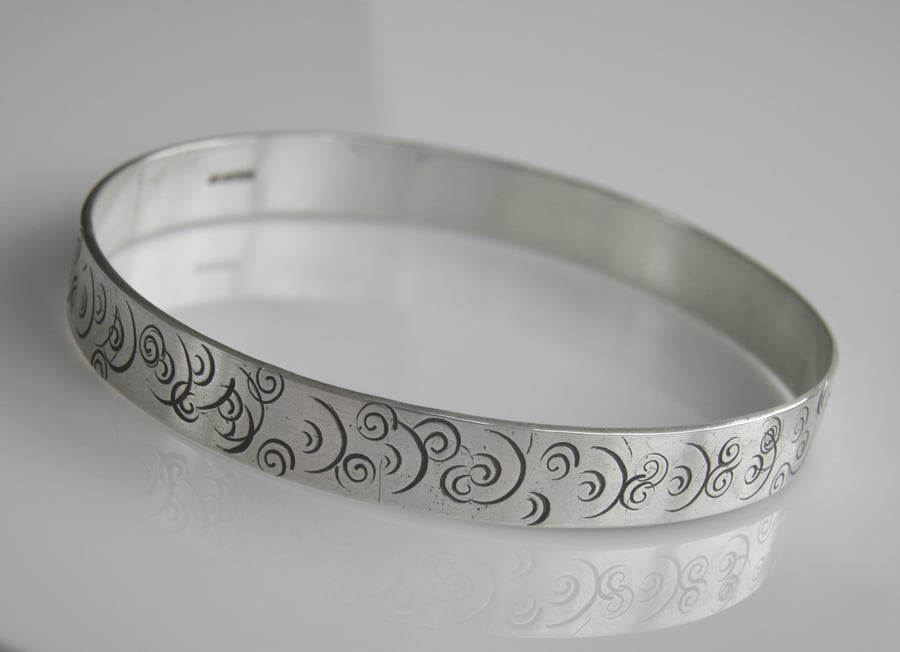 Sterling Silver Bangle with Spiral Design.