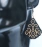 Teardrop Beaded Earrings in Black with Gold Geometric Pattern - Image 3
