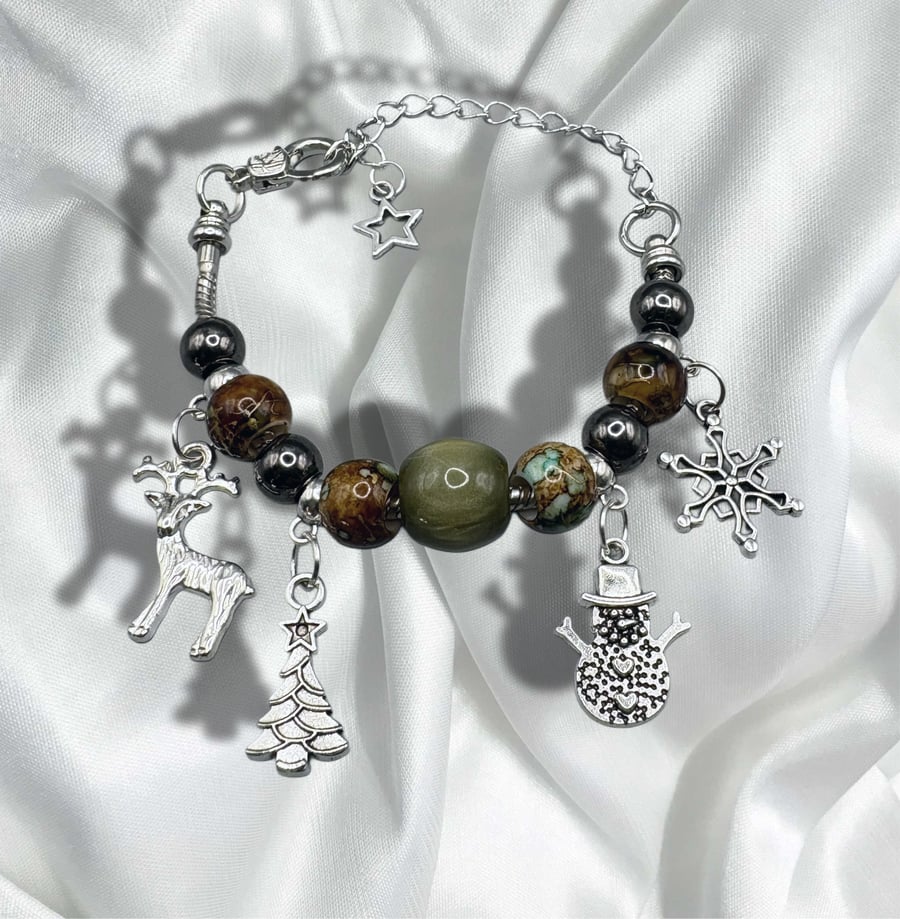 Christmas charm bracelet with traditional colours of red and green 