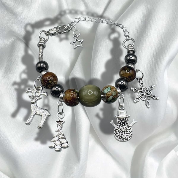Christmas charm bracelet with traditional colours of red and green 