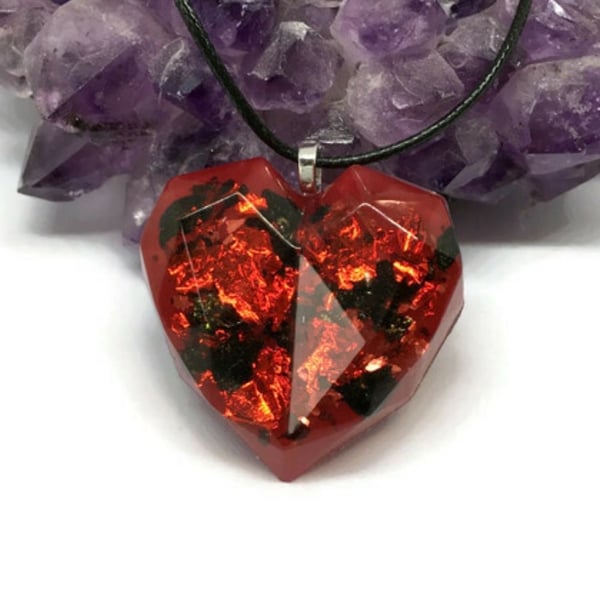 Red heart of fire pendant with black cord necklace.