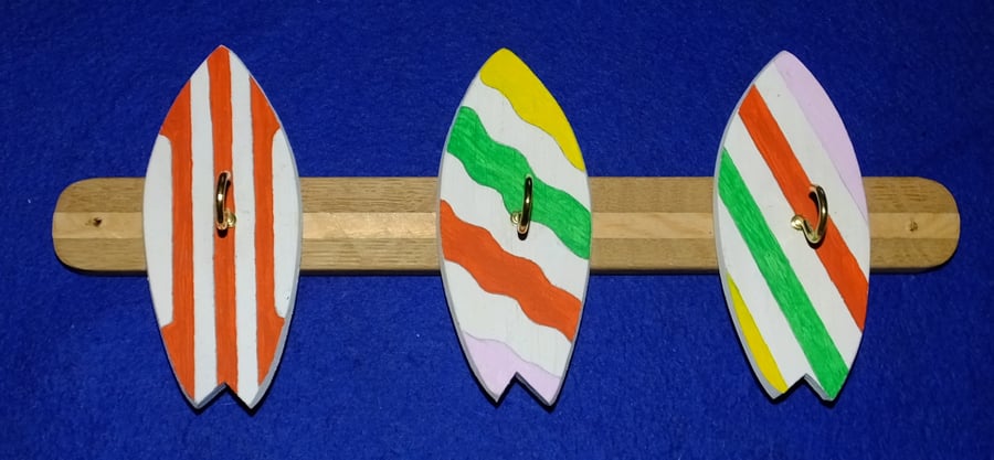  Key rack  holder with three brass hooks on colourful surfboards or bodyboards.