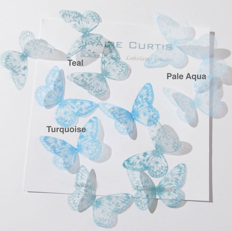 Hand printed silk butterflies in shades of teal. Two sizes